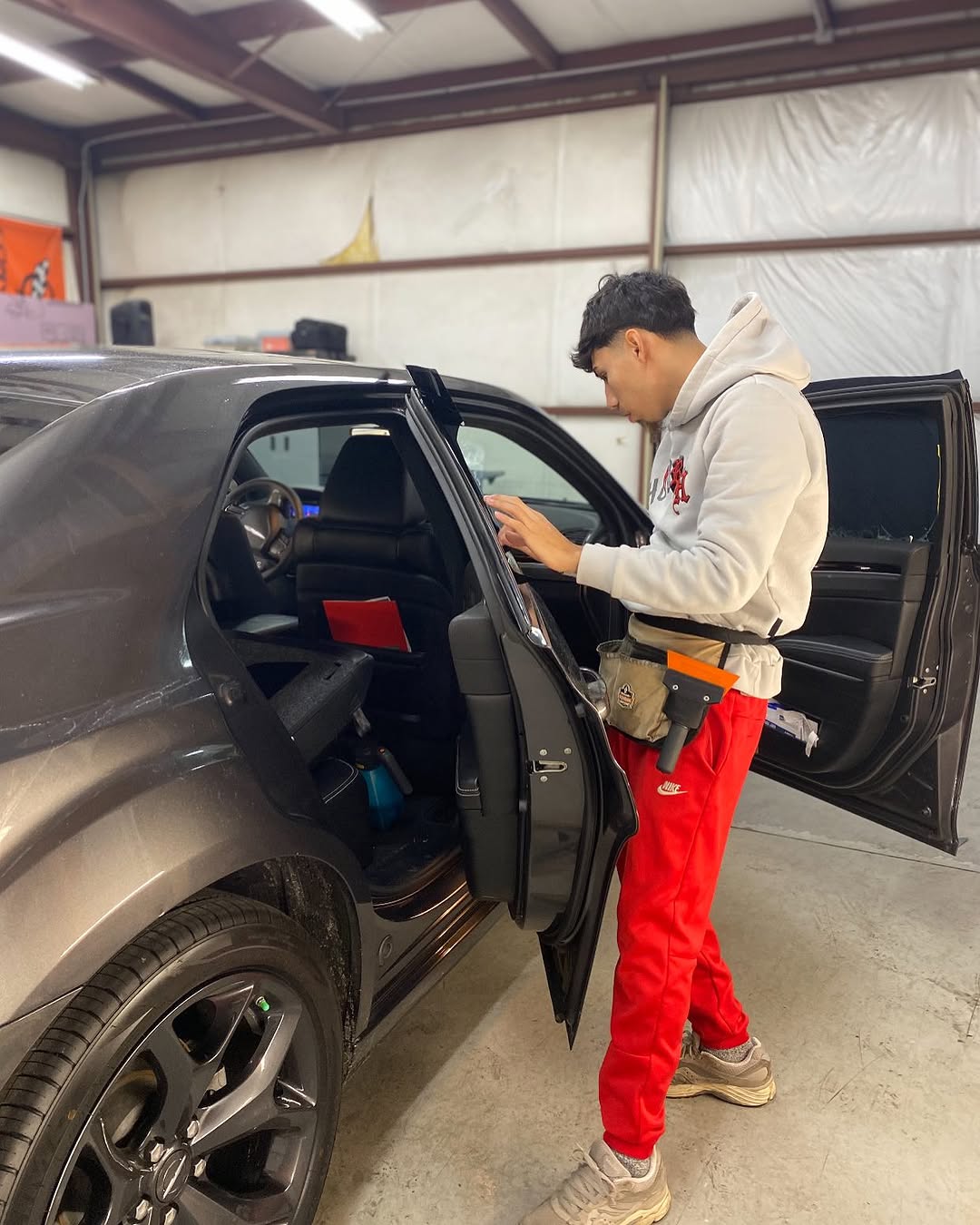 Window tint being professionally installed